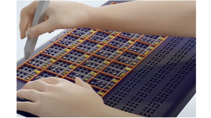child's hands practicing Braille on the BrailleDoodle